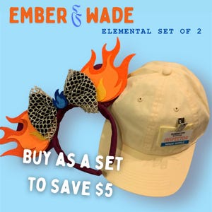 May include: A set of two themed accessories: a headband with flame accents and a light yellow baseball cap. The headband features orange and yellow flames with a black mesh bow. The cap has a tag that reads "ELEMENT CITY INSPECTOR WADE RIPPLE".