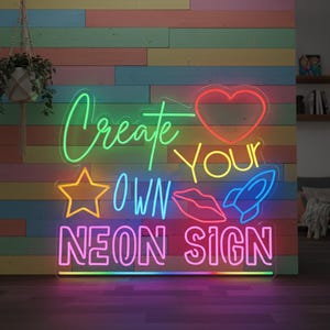 May include: A neon sign with the words "Create Your Own Neon Sign" in various colors. The sign includes a heart, star, lips, and rocket ship. The sign is on a wooden wall with a variety of colors.