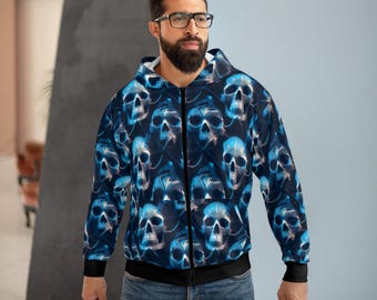 May include: A long-sleeve zip-up hoodie featuring an all-over repeating pattern of blue and white skulls on a dark background. The garment includes a hood, a full-length front zipper, and black ribbed cuffs at the wrists and along the bottom hem.