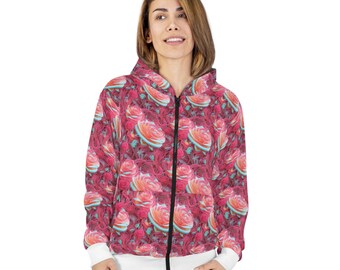 May include: A white zip-up hoodie with a floral print featuring pink and red roses. The hoodie has a white hood and white ribbed cuffs.