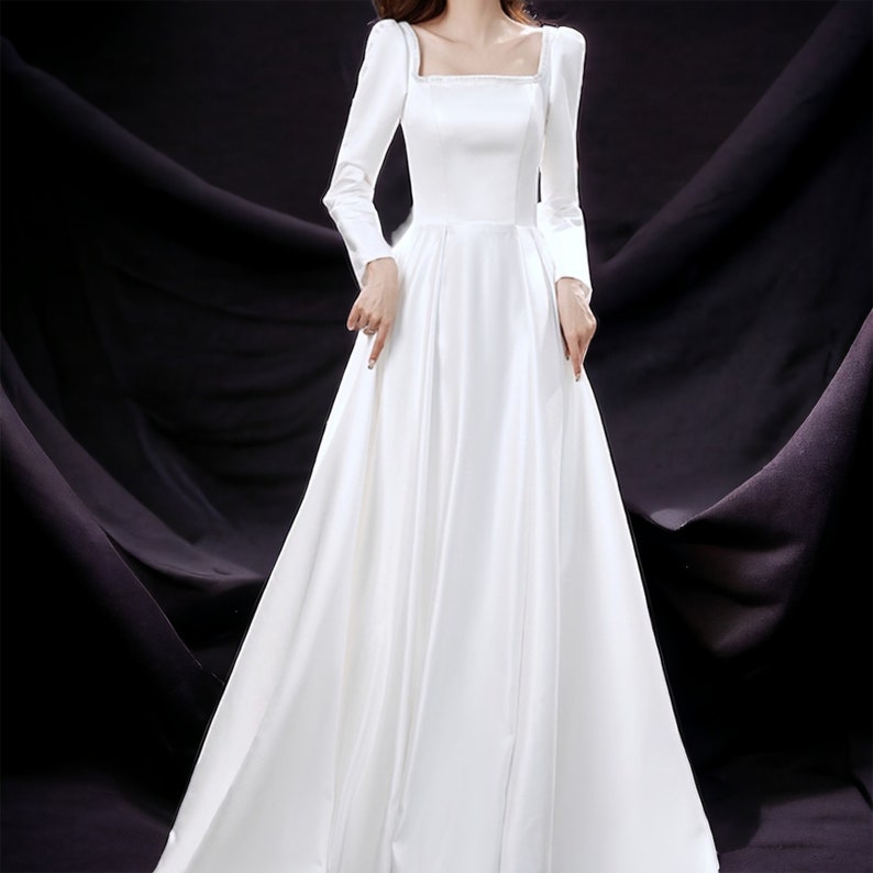 Elegantes weißes hängendes Kleid Bild 4