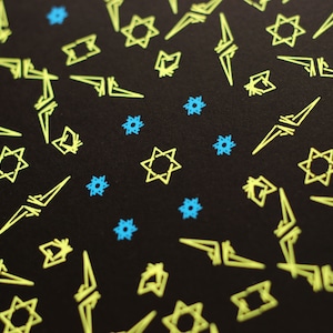 May include: A black background with a repeating pattern of yellow stars and blue stars. The stars are outlined in white.