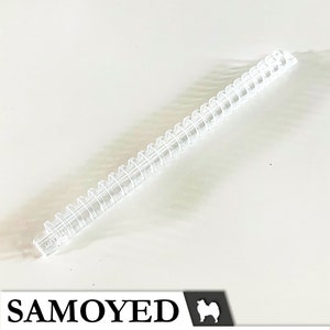 May include: A clear plastic coil binding spine for a notebook or planner. The coil is made of durable plastic and is designed to hold pages securely together.