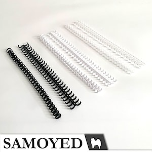 May include: Three black and three white plastic binding coils. The coils are all the same size and are arranged in two rows.