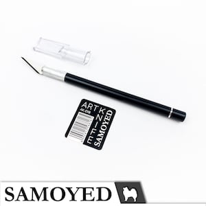 May include: A black retractable craft knife with a silver blade and a clear plastic blade holder. The knife is labelled "ART KNIFE" and "SAMOYED" with a barcode.