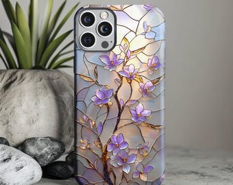 May include: A smartphone case featuring a stained glass design with purple flowers and golden branches. The pattern consists of interlocking geometric shapes in shades of white, light blue, and soft lavender, creating a luminous effect.