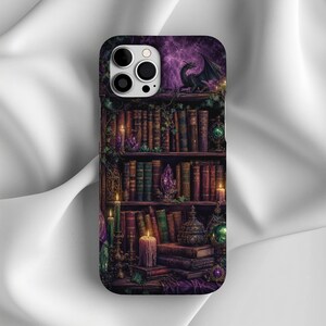Phone case with a mystical bookshelf, dragon, candles, and crystals in purple hues.