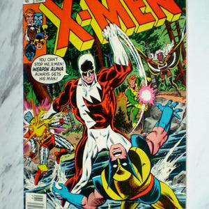 May include: A vintage X-Men comic book, issue 109, featuring a colorful cover illustration of Weapon Alpha battling Wolverine in a forest stream. The text reads Marvel Comics Group, The All-New, All-Different X-Men, and Wanted: Wolverine Dead or Alive!