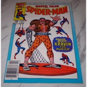 May include: A vintage Marvel Tales Spider-Man comic book featuring Kraven the Hunter. The cover art shows Spider-Man in action, with Kraven in a leopard-print outfit. The comic is a collector's item.