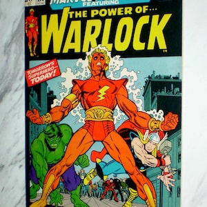 May include: Marvel Comics Group's "Marvel Premiere" comic book featuring "The Power of Warlock." The cover art showcases a central figure in a red and orange costume with a lightning bolt emblem, alongside other comic book characters. The text reads "A Man-God Reborn!"