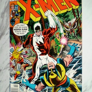 May include: A vintage Marvel Comics X-Men issue 109 comic book featuring a colorful cover illustration of Weapon Alpha fighting Wolverine in a forest stream. The text reads THE ALL-NEW, ALL-DIFFERENT X-MEN, YOU CAN'T STOP ME, X-MEN! WEAPON ALPHA ALWAYS GETS HIS MAN! and WANTED: WOLVERINE DEAD OR ALIVE!