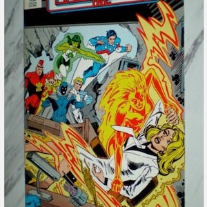 May include: Comic book cover for Infinity Inc. #31, featuring a group of superheroes and a woman engulfed in flames. The cover has the title "INFINITY INC." in large, bold letters, with the words "SHOCK TREATMENT!" at the bottom.