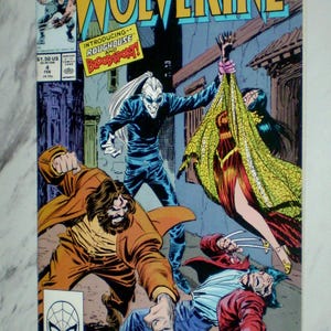 May include: Marvel's Wolverine comic book, issue #4, featuring a dynamic action scene. The cover art showcases Wolverine in a fight, with the text "Wolverine" in large yellow letters. The comic also includes the text "Introducing Roughhouse and Bloodsport!"