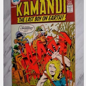 May include: A vintage comic book titled "Kamandi: The Last Boy on Earth!" features a dynamic illustration. The cover is predominantly red and yellow, with action-packed scenes of characters in peril. The price is 25 pence.