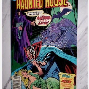 May include: Comic book cover for "Secrets of Haunted House" No. 39. The cover features a dramatic scene with a vampire, a woman in a green dress, and a cloaked figure. Text includes "Nightmare Come to Life!" and "Mister E."