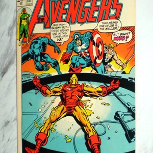 May include: A vintage Marvel Comics Group Avengers issue 106 comic book from December. The cover features Iron Man lying on the ground, surrounded by Black Panther, Captain America, and Hawkeye. Text includes Earth's Mightiest Heroes and A Traitor Stalks Among Us.