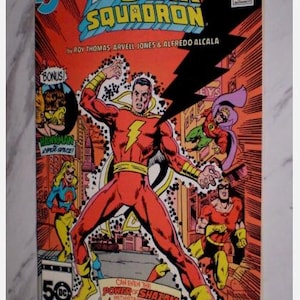May include: A vintage comic book cover for "Crisis on Infinite Earths: All Star Squadron." The cover features a central figure in a red suit with a yellow lightning bolt, surrounded by other costumed characters. The background is a cityscape with bold text.