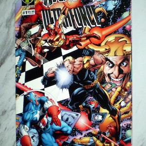 May include: Avengers Ultraforce #1 comic book cover. The cover features various superheroes in action, with vibrant colors and dynamic poses. The Marvel Universe logo is visible, along with the price $3.95.