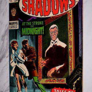 May include: A vintage comic book cover for "Tower of Shadows" #1. The cover features a dramatic scene with figures in a haunted house setting. Text includes "At the Stroke of Midnight!" and "Tales to Blow Your Mind!"