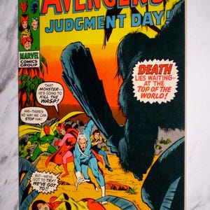 May include: A vintage The Avengers comic book issue 90 titled Judgment Day, featuring a colorful cover illustration of superheroes facing a large dark creature, with text bubbles and the Marvel Comics Group logo visible on the yellow background.