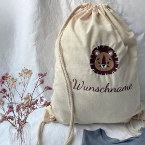 Turnbeutel mit Namen und Motiv bestickt - Personalisierter Stoffbeutel mit Kordelzug aus Baumwolle für Kinder als außergewöhnliches Geschenk