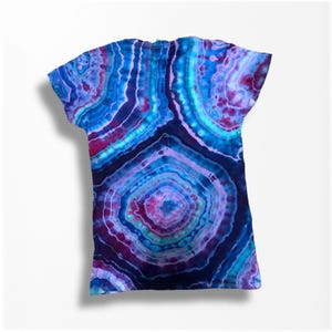 May include: A tie-dye t-shirt with a blue, purple, and pink agate pattern.