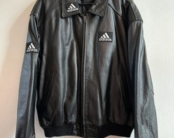 Adidas vintage leather jacket with logo relief on the back panel