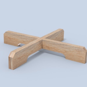 May include: A wooden plant stand with a cross-shaped design. The stand is made of light-coloured wood and features a notched design on each of the four arms. The stand is designed to hold a plant pot. The stand measures approximately 30 cm wide.