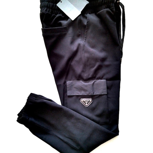 PRADA Black men pants with cargo pocket, cotton and nylon material, drawstring, elastic waist and metal logo