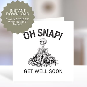 May include: A white greeting card with the words "OH SNAP!" and "GET WELL SOON" in black. The card features a skeleton sitting on a pile of bones. The card is 5.25 x 5.25 inches when cut and folded.