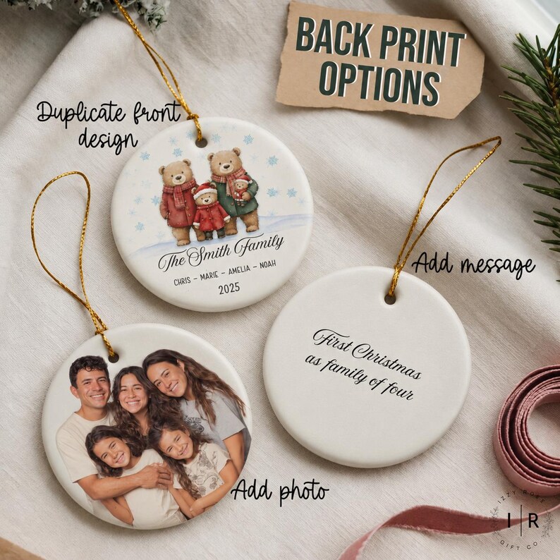 two ornaments, each with a unique design and a message. The first ornament features a family portrait, while the second ornament has a message that reads "First Christmas as family of fear". The ornaments are placed on a white surface, and there is a tag with the text "BACK PRINT OPTIONS" visible in the image.