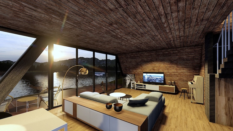 Puede incluir: Un sal&oacute;n moderno con un gran sof&aacute; de esquina, una mesa de centro de madera y un televisor de pantalla plana montado en la pared. La habitaci&oacute;n tiene grandes ventanas con vistas a un lago y monta&ntilde;as. Las paredes est&aacute;n hechas de madera y ladrillo.