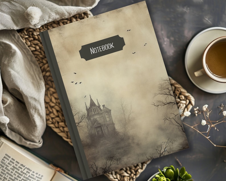 May include: A vintage-style notebook with a spooky, foggy image of a gothic mansion on the cover. The cover has a brown background with a black title that reads "Notebook".
