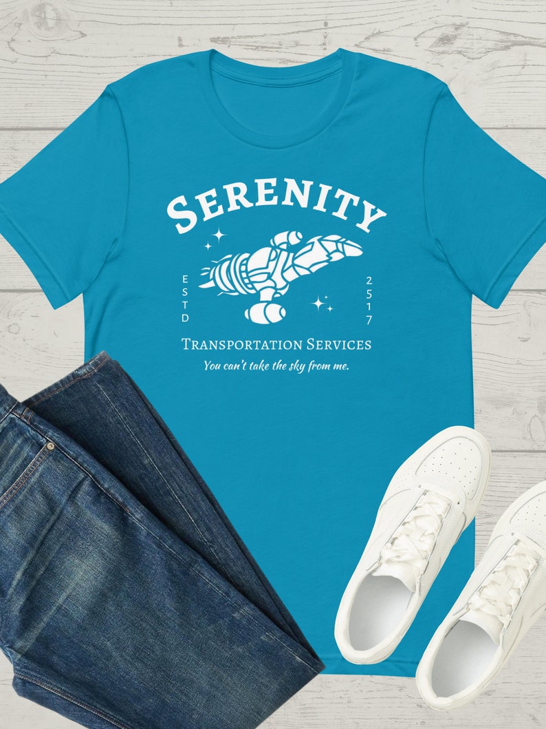 May include: A turquoise blue t-shirt with a white graphic of a spaceship with the text "Serenity Transportation Services" and "You can't take the sky from me."