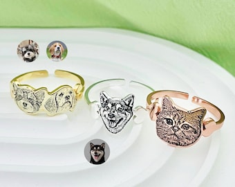 May include: Three adjustable rings with engraved pet portraits. The rings are gold, silver, and rose gold. The portraits are of a dog, a cat, and a dog.