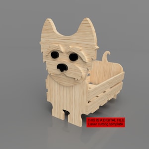 May include: A wooden laser cut template of a dog with a crate in the back. The dog has a black nose and eyes. The text "THIS IS A DIGITAL FILE Laser cutting template" is printed in red at the bottom of the image.