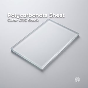 May include: A clear, rectangular polycarbonate sheet, ideal for CNC stock. The text "Polycarbonate Sheet Clear CNC Stock" is displayed in white. The sheet is transparent and rests on a light gray surface.