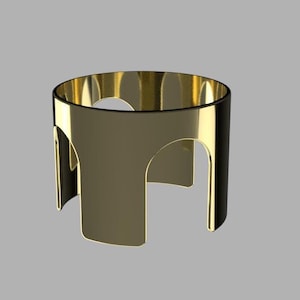 May include: A gold metal stand with a round top and three legs. The stand is designed to hold a bottle or other object.