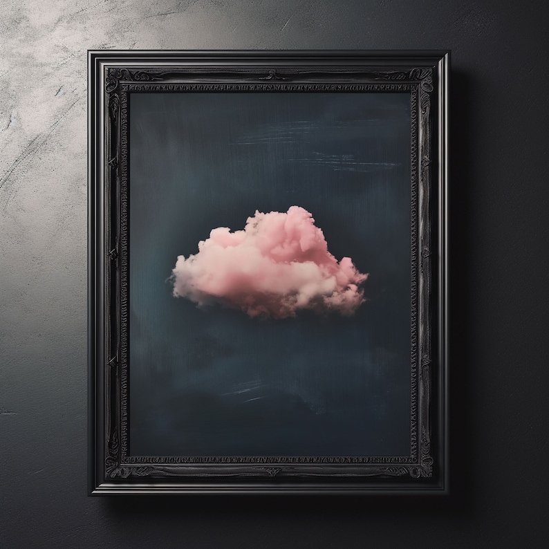 May include: A pink cloud in a black ornate frame against a dark gray background.