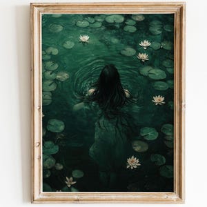 May include: A woman with long dark hair swims in a pond with lily pads and white flowers. The water is a deep green color.