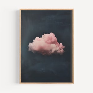 May include: A single, fluffy pink cloud against a dark blue background. The cloud is the focal point of the image, with the dark blue background providing a stark contrast.