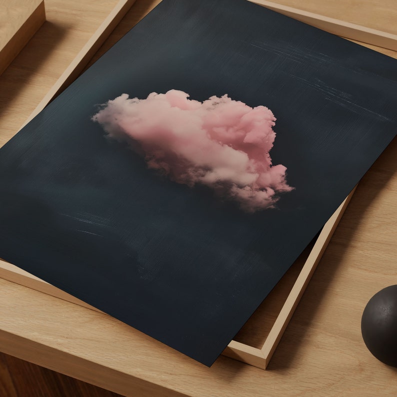 May include: A single, fluffy pink cloud against a dark blue background. The cloud is the focal point of the image, with the dark blue background providing a stark contrast.