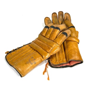 Vintage 1960s leather ice hockey gloves – retro sports memorabilia, collectible gear for hockey enthusiasts