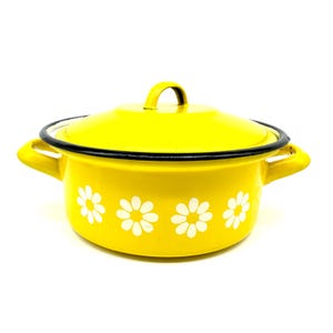 May include: A yellow enamel pot with a lid and two handles. The pot is decorated with white daisy flower designs. The rim and the edge of the lid are outlined in black.