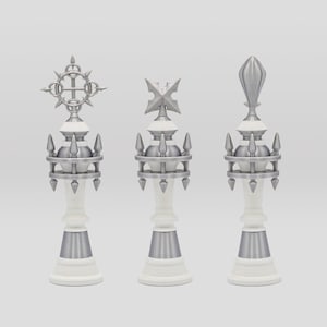 May include: Three silver chess pieces with white bases and different crown designs. The pieces are arranged in a row from left to right.