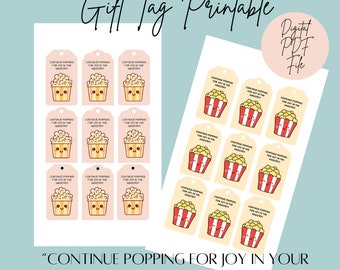 May include: Printable gift tags featuring a cartoon popcorn bucket with the text "CONTINUE POPPING FOR JOY IN YOUR MINISTRY". The tags are in pink and yellow with a white background.