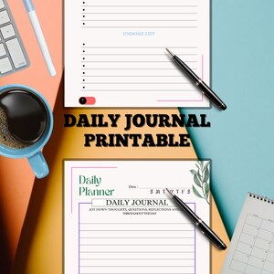 May include: A printable daily journal page with a simple design. The page has a title that says "Daily Journal" and a section for jotting down thoughts, questions, and reflections throughout the day. The page also includes a date section and a section for the days of the week.
