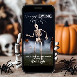 May include: A smartphone screen shows a Halloween party invitation. The invitation features a skeleton, a jack-o'-lantern, and the text "We are just DYING to party with you." The invitation is hosted by Noah & Taylor.