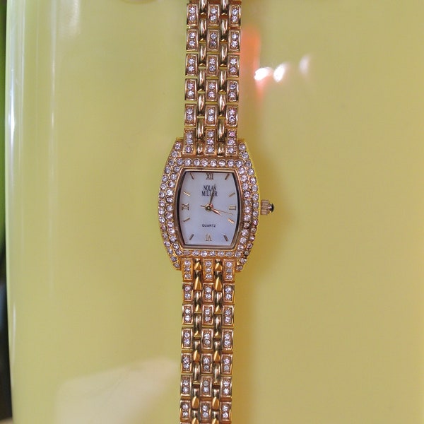 Nolan Miller Glamour Collection Gold Tone Clear Crystal Watch needs battery