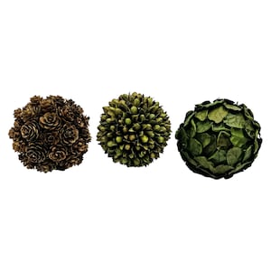 May include: Three decorative spheres. One is made of brown pinecones, the second of green spiky leaves, and the third of green leaves. These spheres are perfect for adding a natural touch to home decor.